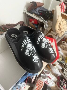 Cousin’s custom Black Slip-On Graphic Clog Shoes with Skull Design